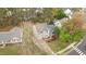 Beautiful aerial view of a two-story home showcasing its well-maintained lawn, landscaping, and inviting front porch at 301 Tillamook Dr, Wake Forest, NC 27587