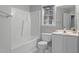 Bright bathroom features a shower-tub combo, modern fixtures, and natural light from the window at 301 Tillamook Dr, Wake Forest, NC 27587