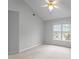 Bright bedroom features a ceiling fan, neutral walls, and large windows allowing for ample natural light at 301 Tillamook Dr, Wake Forest, NC 27587