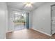Bright dining room featuring a sliding glass door leading to a wooden deck outside at 301 Tillamook Dr, Wake Forest, NC 27587