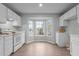 Well-lit kitchen featuring a sunny bay window for natural light and modern appliances at 301 Tillamook Dr, Wake Forest, NC 27587