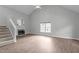 Spacious living room with a fireplace, vaulted ceilings, and hardwood floors, perfect for entertaining at 301 Tillamook Dr, Wake Forest, NC 27587