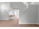 Spacious Living area with hardwood floors and bar seating in open concept to kitchen at 301 Tillamook Dr, Wake Forest, NC 27587