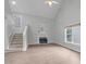 Inviting living area with a fireplace, hardwood floors, and staircase leading to the upper level at 301 Tillamook Dr, Wake Forest, NC 27587