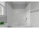 Bright, white shower-tub combo with modern fixtures and a clean design perfect for a refreshing bathing experience at 301 Tillamook Dr, Wake Forest, NC 27587
