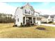 Beautiful two-story home featuring stone accents, a covered porch, manicured landscaping and an attached garage at 3020 Mavisbank Cir, Apex, NC 27502