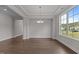 Large living room with hardwood floors, recessed lighting, and natural light at 3020 Mavisbank Cir, Apex, NC 27502