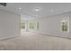 Large main bedroom featuring neutral walls, recessed lighting, and an en-suite bathroom at 3020 Mavisbank Cir, Apex, NC 27502