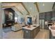 Open-concept living area featuring modern kitchen, fireplace, and cozy seating at 303 Gilliland Rd, Siler City, NC 27344