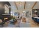 Living room boasts custom ceilings, stylish lighting, and a fireplace for a cozy ambiance at 303 Gilliland Rd, Siler City, NC 27344