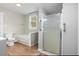 Well-lit bathroom featuring bathtub and shower at 308 Charles St, Henderson, NC 27536
