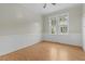 Inviting bedroom with natural light from the windows, and wood floors at 308 Charles St, Henderson, NC 27536
