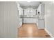 Bright kitchen featuring white cabinets, granite countertops, and plenty of natural light at 308 Charles St, Henderson, NC 27536