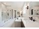 Luxurious bathroom with walk-in shower, soaking tub, and double sink vanity with modern black fixtures at 315 Gilliland Rd, Siler City, NC 27344