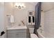 Clean bathroom with white subway tile, shower-tub combo, and modern fixtures at 315 Gilliland Rd, Siler City, NC 27344