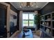 Well-lit office features hardwood floors, stylish decor, and a large window with a scenic view at 321 Gilliland Rd, Siler City, NC 27344