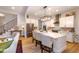 Modern kitchen featuring stainless steel appliances, white cabinetry, and island with bar seating at 367 Gilliland Rd, Siler City, NC 27344