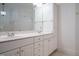 Bathroom features a double sink vanity with ample cabinet space and decorative lighting at 3700 Baron Cooper Pass # 104, Raleigh, NC 27612