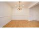 Elegant dining room featuring a chandelier and hardwood floors at 3700 Baron Cooper Pass # 104, Raleigh, NC 27612