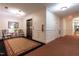 Well-maintained hallway with an elevator, chairs, and access to building amenities at 3700 Baron Cooper Pass # 104, Raleigh, NC 27612