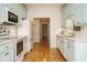 Charming kitchen with updated appliances and aqua colored cabinets at 3700 Baron Cooper Pass # 104, Raleigh, NC 27612