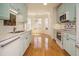 Bright kitchen featuring stainless appliances and marble countertops at 3700 Baron Cooper Pass # 104, Raleigh, NC 27612