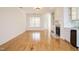 Open concept living room with fireplace, wet bar, and lots of natural light at 3700 Baron Cooper Pass # 104, Raleigh, NC 27612