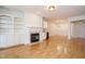 Large living room featuring fireplace, built-in cabinets and light wood flooring at 3700 Baron Cooper Pass # 104, Raleigh, NC 27612