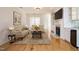 Comfortable living room features a fireplace, built-in bar area, and plenty of natural light at 3700 Baron Cooper Pass # 104, Raleigh, NC 27612
