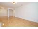 Bright and airy living area with hardwood floors and large doorway to other rooms at 3700 Baron Cooper Pass # 104, Raleigh, NC 27612