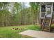 Lush backyard with mature trees and a stone garden, providing a relaxing outdoor space at 3729 Norman Blalock Rd, Willow Springs, NC 27592