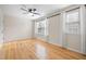 Bedroom featuring hardwood floors, a ceiling fan, and two windows with natural light at 3729 Norman Blalock Rd, Willow Springs, NC 27592