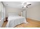 Cozy bedroom offers hardwood floors and a comfortable bed with soft, natural light at 3729 Norman Blalock Rd, Willow Springs, NC 27592