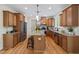 Well-appointed kitchen with a large island, granite countertops, and stainless steel appliances at 3729 Norman Blalock Rd, Willow Springs, NC 27592