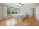 Main bedroom featuring hardwood floors, a ceiling fan, and lots of natural light at 3729 Norman Blalock Rd, Willow Springs, NC 27592