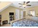 Bedroom with ceiling fan, large dresser, and tv, offering a cozy and functional space at 432 Kings Hollow Dr, Raleigh, NC 27603