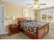 Bedroom featuring a dark wood bed frame, ceiling fan, and natural light at 432 Kings Hollow Dr, Raleigh, NC 27603