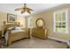 Primary bedroom featuring natural lighting, decorative ceiling fan and light wood furniture at 432 Kings Hollow Dr, Raleigh, NC 27603