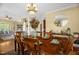 Charming dining room featuring hardwood floors, chandelier, and access to the living spaces at 432 Kings Hollow Dr, Raleigh, NC 27603