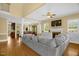 Spacious living room with hardwood floors, large windows, fireplace, and open layout to the dining area at 432 Kings Hollow Dr, Raleigh, NC 27603