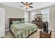Bedroom with a king bed, ceiling fan, and natural lighting at 45 Summersweet Ln, Chapel Hill, NC 27516