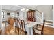 Inviting dining room featuring hardwood floors, staircase, and a seamless flow to the kitchen and living room at 45 Summersweet Ln, Chapel Hill, NC 27516