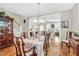 Warm dining room with hardwood floors that transitions to the living area providing an open and airy feel at 45 Summersweet Ln, Chapel Hill, NC 27516