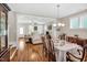 Bright dining room flows into the living area, creating an open-concept space with hardwood floors and natural light at 45 Summersweet Ln, Chapel Hill, NC 27516