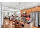 Modern kitchen with stainless steel appliances and granite counters, opens seamlessly into the dining and living areas at 45 Summersweet Ln, Chapel Hill, NC 27516