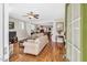 Bright living room boasts hardwood floors and a seamless transition to the dining area, perfect for entertaining at 45 Summersweet Ln, Chapel Hill, NC 27516