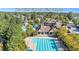 Aerial view of The Briar Club pool featuring a lazy river, pool slide, and outdoor seating at 45 Summersweet Ln, Chapel Hill, NC 27516