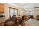 Open dining area with hardwood floors, a large table, and a view into the living room at 518 N Gutherie Ave, Durham, NC 27703
