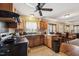 Functional kitchen featuring wood cabinets and a view into the dining and living areas at 518 N Gutherie Ave, Durham, NC 27703