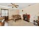 Comfortable living room with ceiling fan, fireplace, and cozy sofa at 518 N Gutherie Ave, Durham, NC 27703